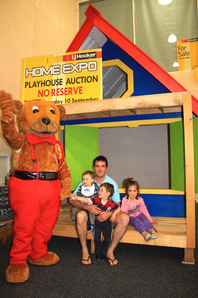 Chris Young with Hayley, Lochy and Campbell are delighted with their new playhouse