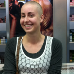 Close shave: Katie Levendis after shaving her blonde locks for famine victims