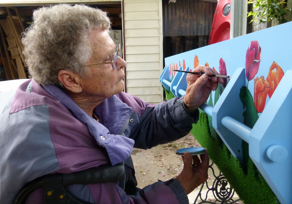 Finishing touches: Rose Gray paint tulips on her coffin to represent her Dutch heritage. Finishing touches: Rose Gray paint tulips on her coffin to represent her Dutch heritage.