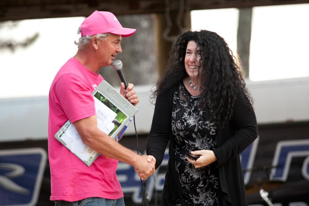 Noddy Watts congratulates a speechless Michelle Phelps after she won a Model T Ford hotrod on a $5 ticket