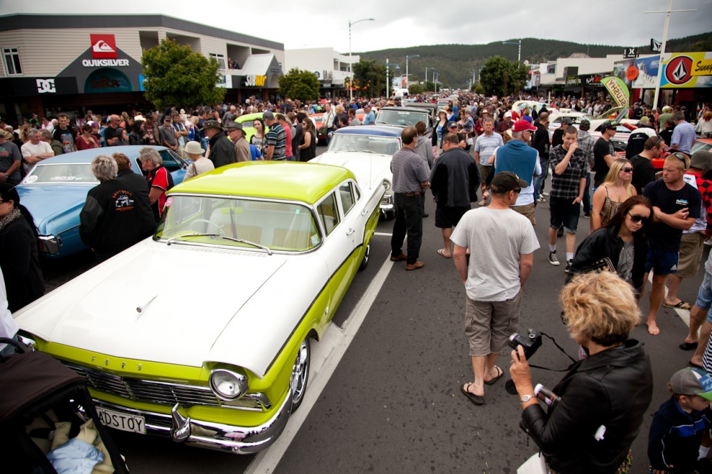 Crowds admire some of the 100 classic cars and hot rods at the Whangamata beach hop