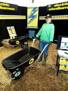 Faith Baldry with a mechanical wheelbarrow. Photo by Evie Marinkovich