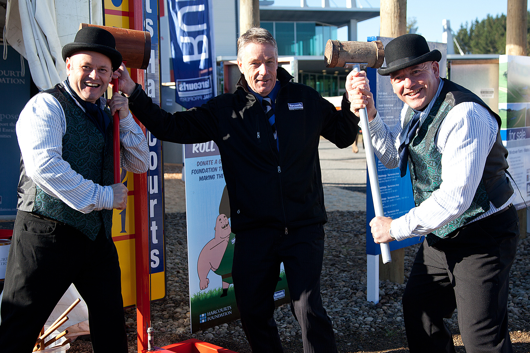 Brett Tutherbridge, Jim Davis and John Martin outside the Harcourts tent