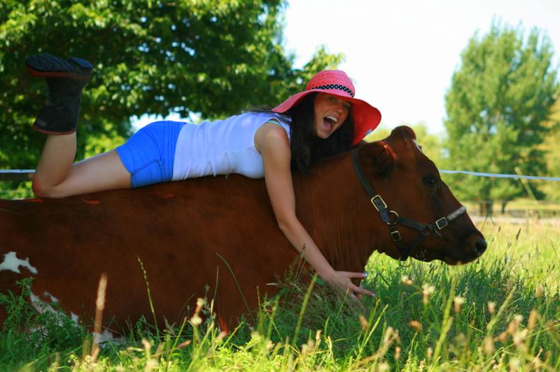 BEST BUDDIES: Daina hanging out with her pet cow Chyna. Photo: Shannon Rolfe