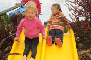 HAVING A SLIDE OF A TIME: Sophie Rissetto (left) and Kaitlyn Ross. Photo: Daniel Whitfield