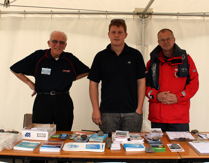 Jim Thomson, Matthew Hayes and Simon Barker overlooking the Tauranga Coastguard stand.