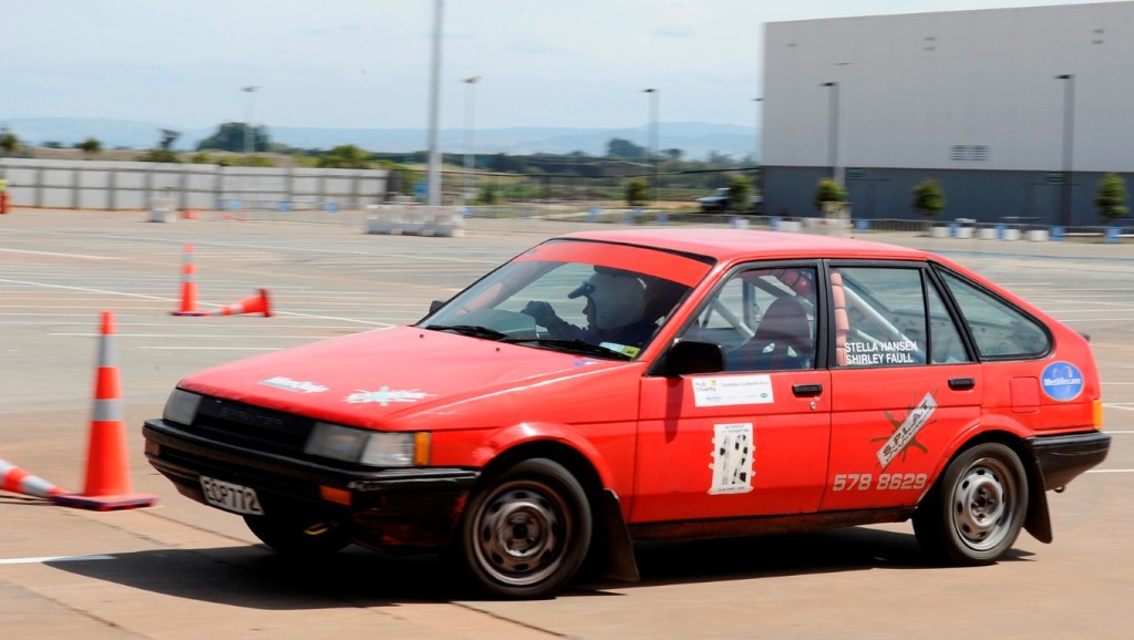 GRANNY RACER: Shirley navigates her Toyota Corolla around a skills course. Photo: Corey Rosser