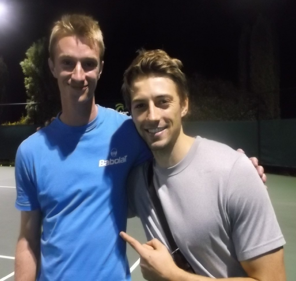 Nz Tennis Academy coach Nick Hatchett(left) still standing after 12 hours of playing tennis for charity. with tennis buddy Ido Drent at the Waikato Tennis Centre in Hamilton.