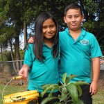 LINKING BACK TO ROOTS: Pounamu Kora and Te Maia Kora happy with their tree PHOTO: Jayden Parker