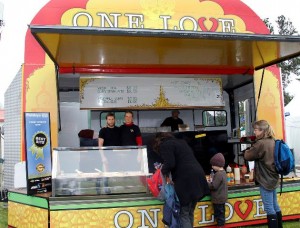 VEGETARIAN WINNER: Dhruva Reid runs his vegetarian stall One Love with his wife. Photo:Lauren Bovaird 