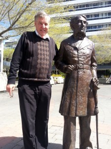 West Ward candidate Martin Gallagher stands beside the "Captain Hamilton" statue in Garden Place. Photo by: Taylor Sincock