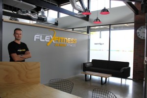 Managing Director Tony Tracey inside the industrial styled entrance of Flex Fitness Morrinsville. Photo: Megan Cameron