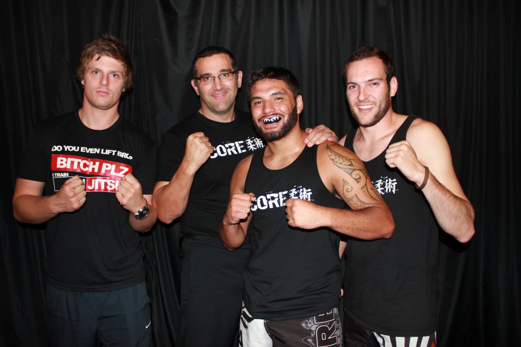 Julius Poananga (front) after his first round submission at Shuriken MMA Elimination with coaches from left Joesef Hamblin, Mark Craig and Carlo Meister. Photo: Don Rowe 