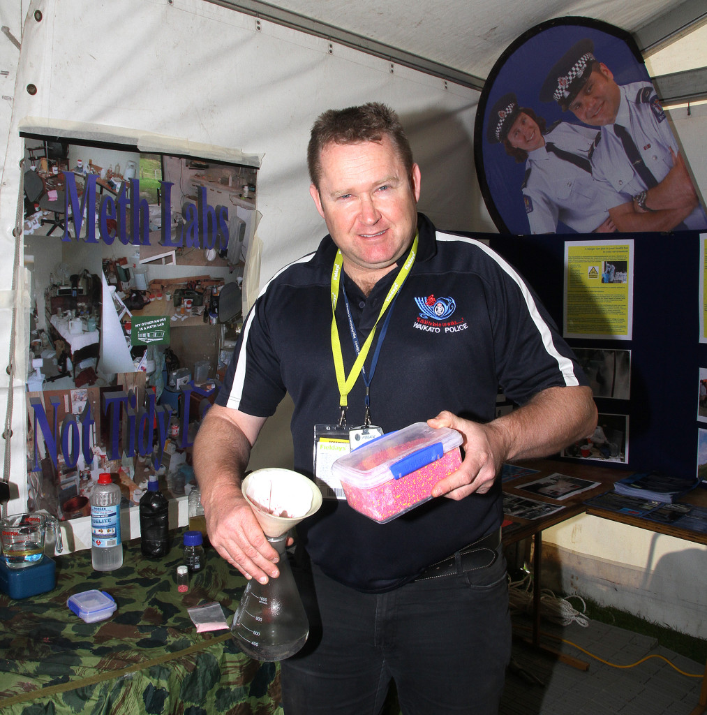 Police Communications Manager Andrew McAlley  shows some of the items used to make methamphetamine. Photo: Michelle Corbett