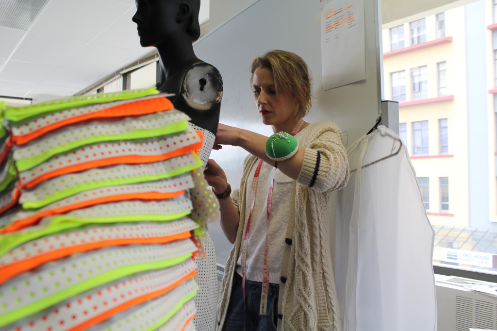 FLURO ACTIVE: Second year fashion student Madeleine Schulz working on her safety jackets inspired collection. Photo: Dasha Kuprienko