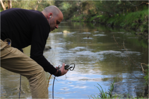 Kent MacPherson recording the sounds of the Waikato River in Hamilton