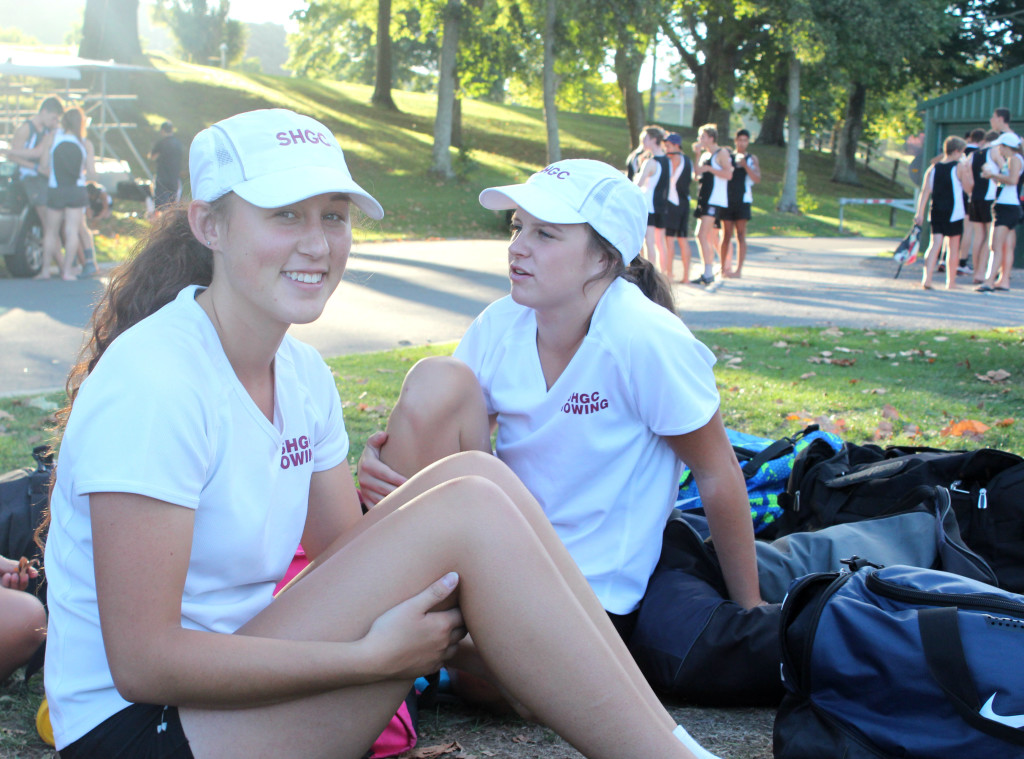 TAKE A BREAK: The captain Claudia Mecchia, 16 and Camryn Fell, 16 are having a well-deserved break after an evening training at the Karapiro. PHOTO: Dasha Kuprienko