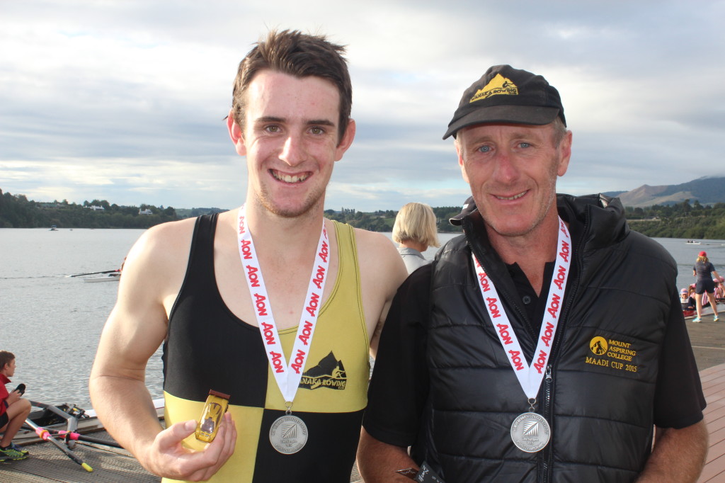 Riley Bruce with his father Robert Bruce after his Silver medal win in the U17 single scull. Photo: Emmeline Sunnex