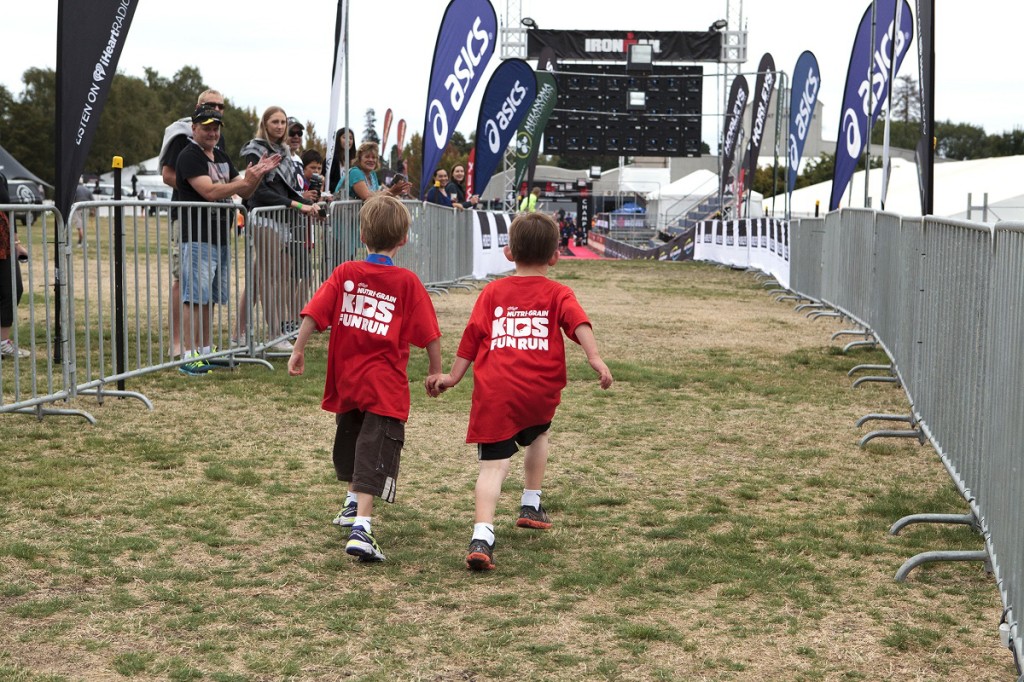 Brothers in arms: Nathaniel (5) supports his brother, Hamish (5) Wood in the finishing stages of the Ironkids race
