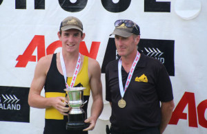 WINNERS ARE GRINNERS: Riley (L) and Rob Bruce collect the u16 single sculls gold at Maadi 2013. Photo: Supplied