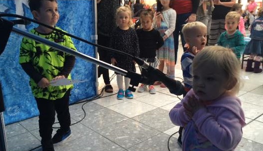 LET IT GO: Ashdyn, Maddox and Giselle singing at the Frozen karaoke zone. Photo: Nicola Kelly