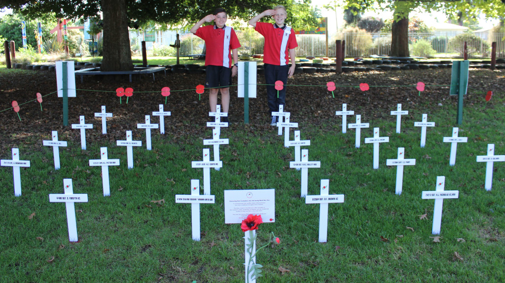 RESPECT: Rhode Street School students Tyler Urwin-Hull (left) and Chris Everitt salute the fallen troops. Photo: Christopher Reive