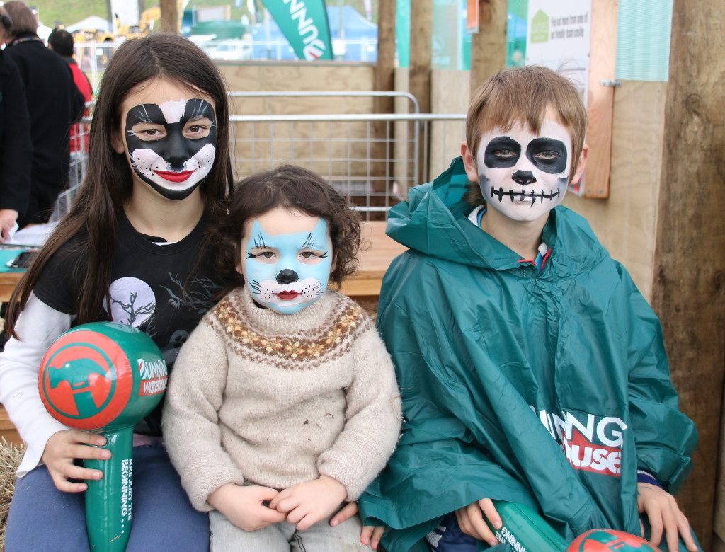 Painted: Chloe, Oliver, and Carlos Wharekawa show off their painted faces. Photo: Garrick Dyer