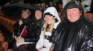 Sport Waikato Community Sport Advisor Gilly Alexander & family get rain proofed up to watch the game. From left to right: Gilly with children Cameron and Kyra and husband Ross. Photo: Emmeline Sunnex