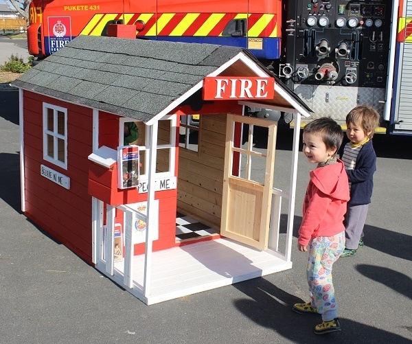 PLAYHOUSE: Yuto (left) and Kota enjoyed the delivery from the Fire Fighters. Photo: Shontelle Cargill