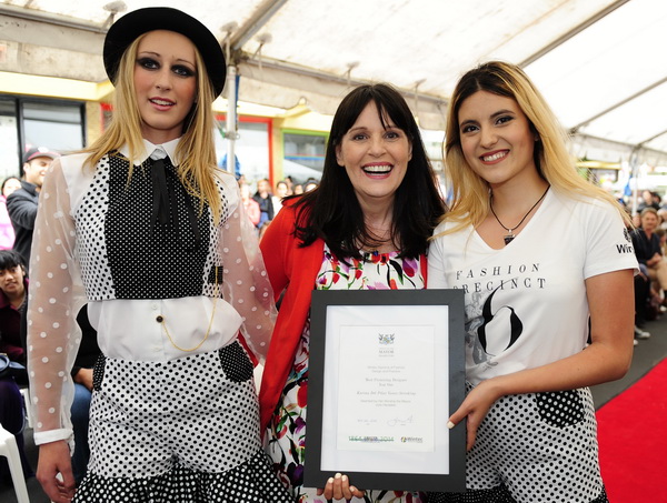 FASHION: Mayor Julie Hardaker with former fashion design student Karina Yanez (right) and her model showcasing her work at the 2014 runway show. Photo: Geoff Ridder