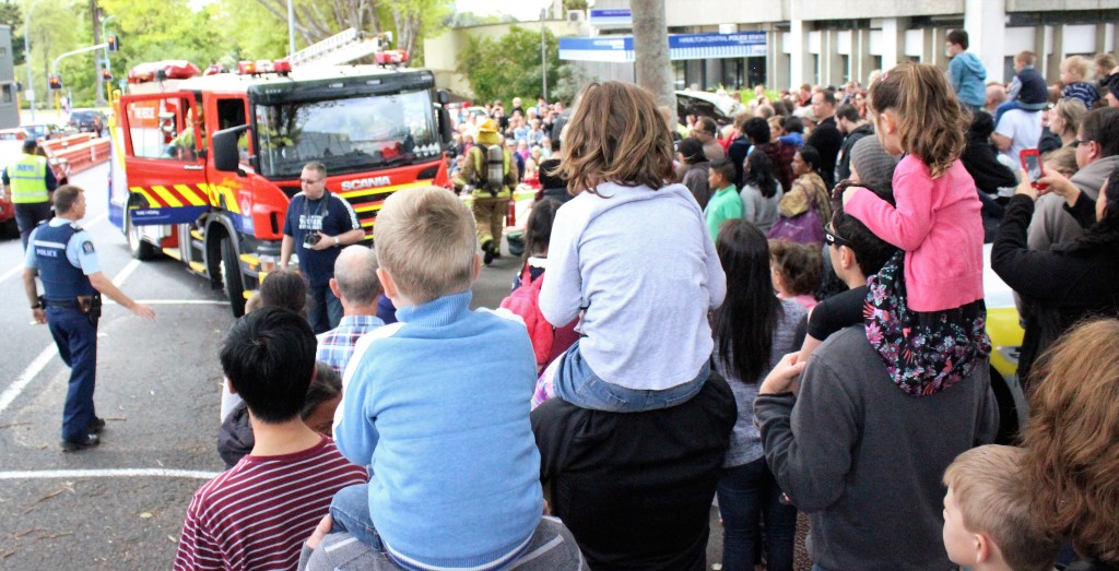 People young and old gather to watch a mock rescue at the Hamilton Police open day. Photo: Christopher Reive.
