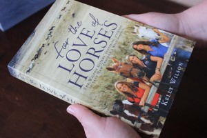 Wilson sister's fan Tonya Boggiss holding her copy of 'For the Love of Horses' book written by Kelly Wilson. Photo: Shontelle Cargill