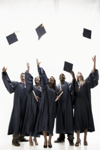 Graduates throwing mortarboards