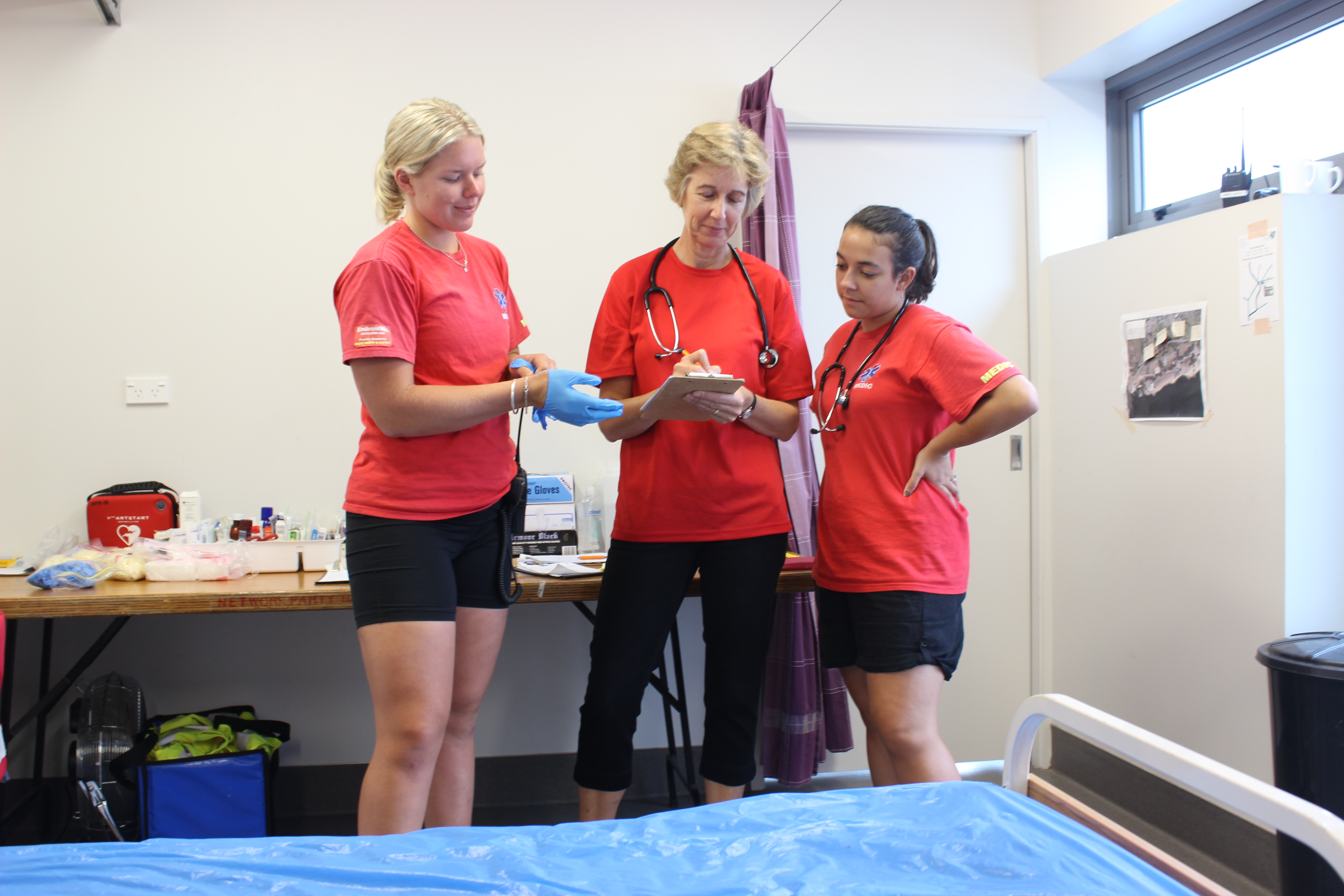 EMS team ready to help at Aon Maadi cup. From left Kelsi Parker 22, Jill Porritt 51, Vanessa Wiley 21. Photo: Emelyn McHardy